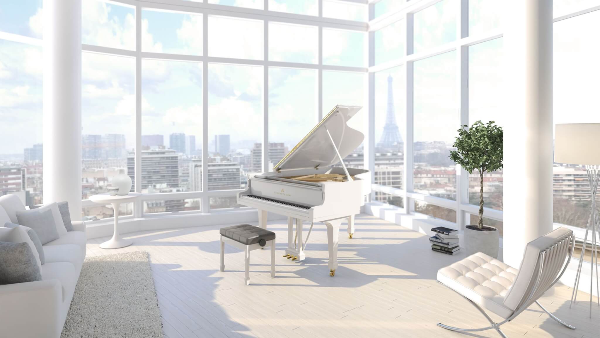 Model A white piano located inside an upscale penthouse