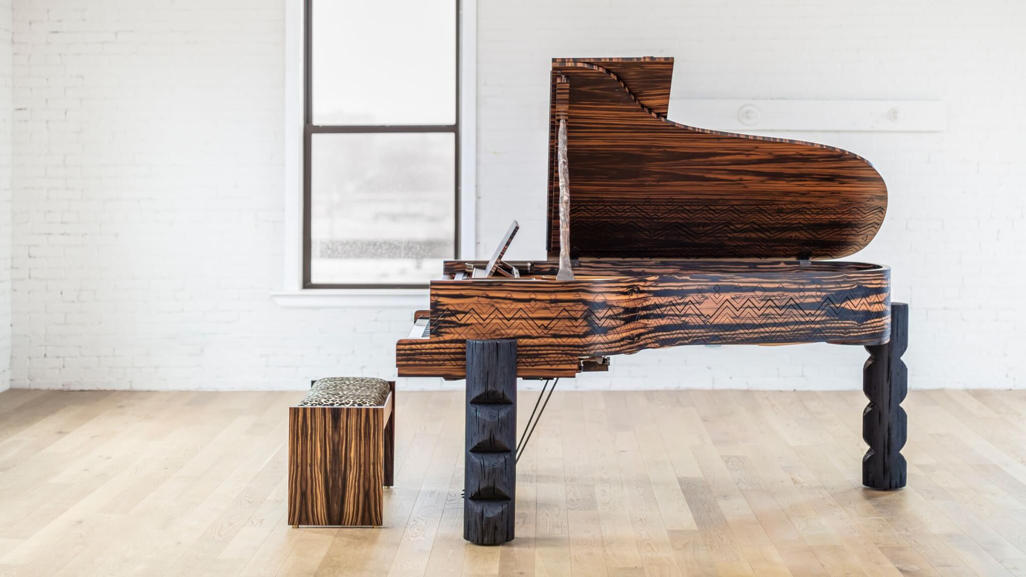 Steinway Kravitz Grand Piano located inside a living room with wooden flooring